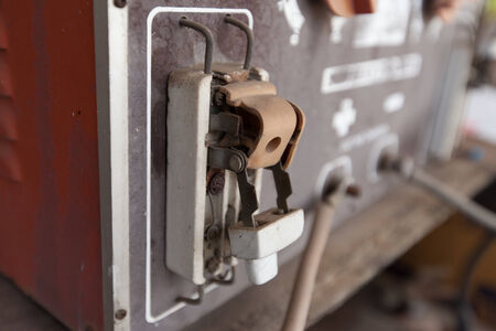 Broken vintage retro large electric circuit breaker with protection fuse.の写真素材