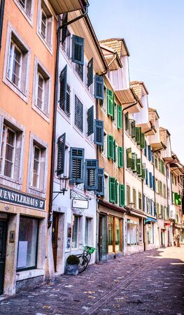 Cobblestone street with old and colorful houses in old city of Solothurn, Switzerlandの写真素材