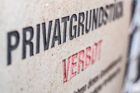 Old and rusty private Property sign on a barred gate, warning text, entry forbidden, Close-upの写真素材