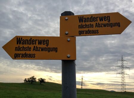 Sign post of swiss hiking trails. Confusing, superfluous sign, Switerlandの写真素材