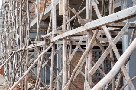 Wood scaffolding in the house construction site.の写真素材