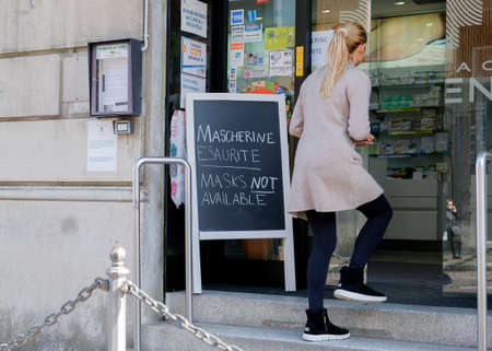 Italy, Como, March, sign in front of pharmacy during coronavirus covid-19, indicates surgical masks sold outのeditorial素材