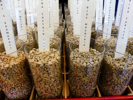glass containers with coffee beans. There are various types of raw coffee, arabica, robusta, blue montain, Costa Ricaの写真素材