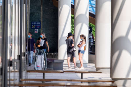 Italy, Milan, 05/31/2020, people walk wearing surgical mask due to the social distance for coronavirus covidのeditorial素材
