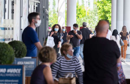 Italy, Milan, 05/31/2020, people walk wearing surgical mask due to the social distance for coronavirus covidのeditorial素材