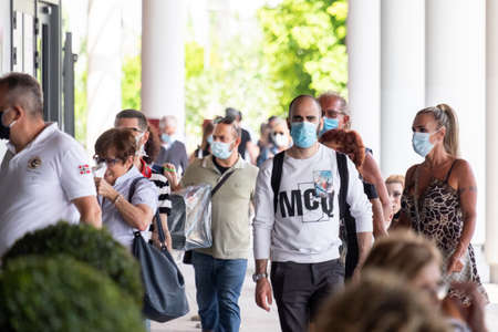 Italy, Milan, 05/31/2020, people walk wearing surgical mask due to the social distance for coronavirus covidのeditorial素材