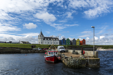 John O'Groats sea dock, colorful houses, ships, scottish highlandsのeditorial素材