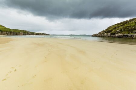 Scottish Highlands beach in Durness, White Sands and Gray Skyの写真素材