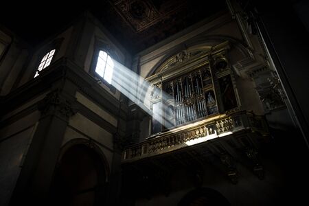 Light enters from the window in the church of Badia Fiorentina in Florence