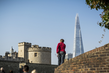 Kid walking towards the Shard in Londonの写真素材