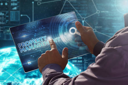 Internet. Business. Technology concept.
Businessman presses a button Property Management on the virtual screen tablet future date.の写真素材