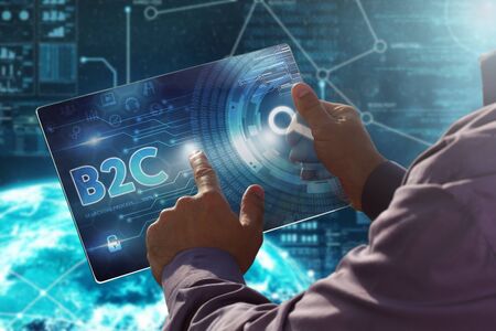 Internet. Business. Technology concept.
Businessman presses a button B2C on the virtual screen tablet future date.の写真素材