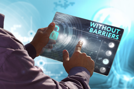 Business, Technology, Internet and network concept. Young business man, working on the tablet of the future, select on the virtual display: Without barriersの写真素材