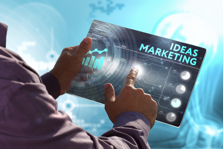 Business, Technology, Internet and network concept. Young business man, working on the tablet of the future, select on the virtual display: ideas marketingの写真素材