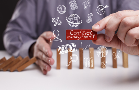 Business, Technology, Internet and network concept. Young businessman shows the word: Conflict management の写真素材