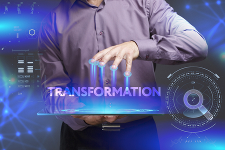 Business, Technology, Internet and network concept. Young businessman shows the word on the virtual display of the future: Transformationの写真素材