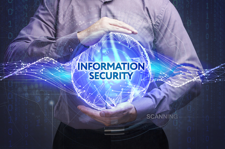 Business, Technology, Internet and network concept. Young businessman shows the word: Information securityの写真素材