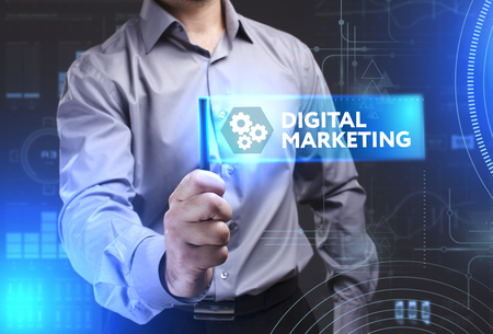 Business, Technology, Internet and network concept. Young businessman showing a word in a virtual tablet of the future: Digital Marketingの写真素材