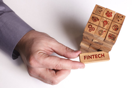 Business, Technology, Internet and network concept. Young businessman shows the word: Fintechの写真素材