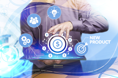 Business, Technology, Internet and network concept. Young businessman working on a virtual screen of the future and sees the inscription: New productの写真素材
