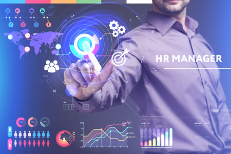 Business, Technology, Internet and network concept. Young businessman working on a virtual screen of the future and sees the inscription: HR managerの写真素材