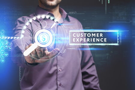 Business, Technology, Internet and network concept. Young businessman working on a virtual screen of the future and sees the inscription: Customer experienceの写真素材