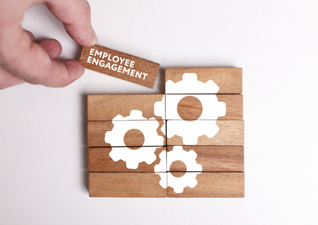 Business, Technology, Internet and network concept. Young businessman shows the word: Employee engagementの写真素材