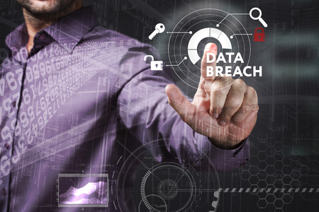 Business, Technology, Internet and network concept. Young businessman working on a virtual screen of the future and sees the inscription: Data breachの写真素材