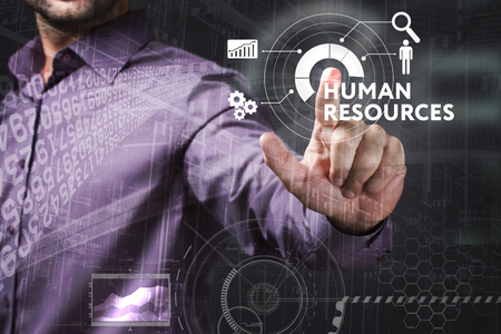 Business, Technology, Internet and network concept. Young businessman working on a virtual screen of the future and sees the inscription: Human resourcesの写真素材