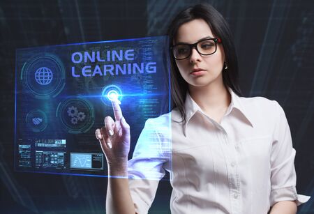 The concept of business, technology, the Internet and the network. A young entrepreneur working on a virtual screen of the future and sees the inscription: Online learningの写真素材