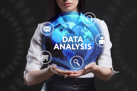 The concept of business, technology, the Internet and the network. A young entrepreneur working on a virtual screen of the future and sees the inscription: Data analysisの写真素材