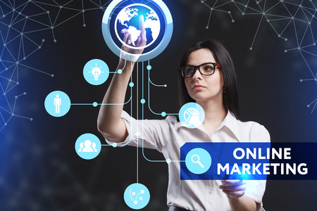 The concept of business, technology, the Internet and the network. A young entrepreneur working on a virtual screen of the future and sees the inscription: Online marketingの写真素材