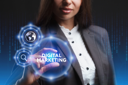 The concept of business, technology, the Internet and the network. A young entrepreneur working on a virtual screen of the future and sees the inscription: Digital Marketingの写真素材