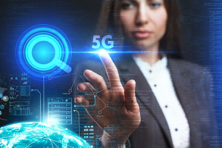 The concept of business, technology, the Internet and the network. A young entrepreneur working on a virtual screen of the future and sees the inscription: 5Gの写真素材