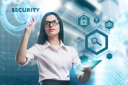 The concept of business, technology, the Internet and the network. A young entrepreneur working on a virtual screen of the future and sees the inscription: Securityの写真素材