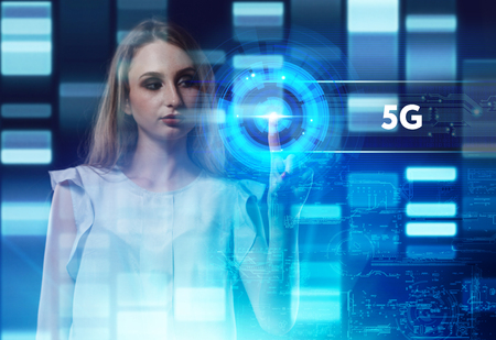 The concept of business, technology, the Internet and the network. A young entrepreneur working on a virtual screen of the future and sees the inscription: 5Gの写真素材