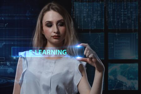 The concept of business, technology, the Internet and the network. A young entrepreneur working on a virtual screen of the future and sees the inscription: E-learningの写真素材