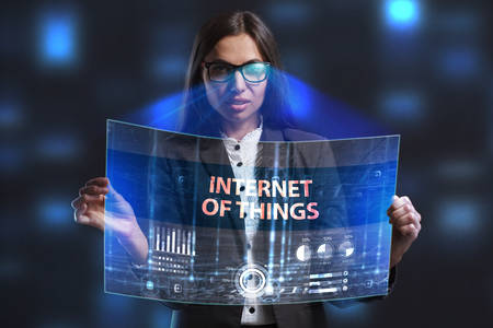The concept of business, technology, the Internet and the network. A young entrepreneur working on a virtual screen of the future and sees the inscription: Internet of thingsの写真素材