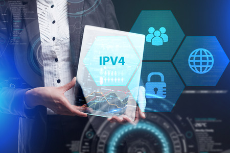 The concept of business, technology, the Internet and the network. A young entrepreneur working on a virtual screen of the future and sees the inscription: IPv4の写真素材