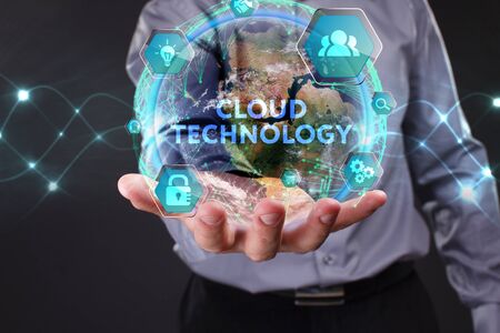 The concept of business, technology, the Internet and the network. A young entrepreneur working on a virtual screen of the future and sees the inscription: Cloud technologyの写真素材