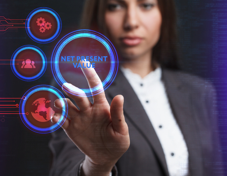 The concept of business, technology, the Internet and the network. A young entrepreneur working on a virtual screen of the future and sees the inscription: Net present valueの写真素材