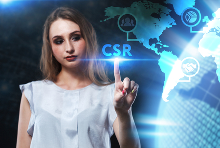The concept of business, technology, the Internet and the network. A young entrepreneur working on a virtual screen of the future and sees the inscription: CSRの写真素材