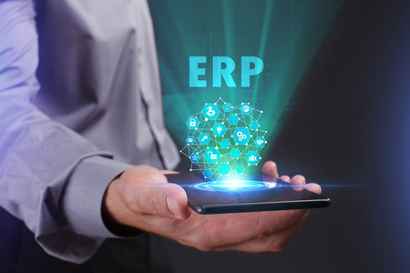 The concept of business, technology, the Internet and the network. A young entrepreneur working on a virtual screen of the future and sees the inscription: ERPの写真素材