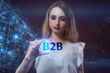 The concept of business, technology, the Internet and the network. A young entrepreneur working on a virtual screen of the future and sees the inscription: B2Bの写真素材