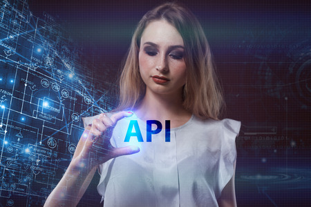 The concept of business, technology, the Internet and the network. A young entrepreneur working on a virtual screen of the future and sees the inscription: APIの写真素材