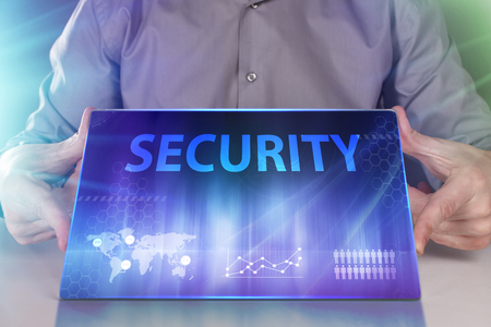 The concept of business, technology, the Internet and the network. A young entrepreneur working on a virtual screen of the future and sees the inscription: Securityの写真素材