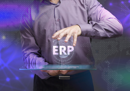 The concept of business, technology, the Internet and the network. A young entrepreneur working on a virtual screen of the future and sees the inscription: ERPの写真素材