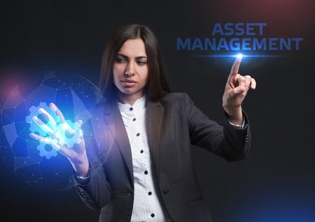 The concept of business, technology, the Internet and the network. A young entrepreneur working on a virtual screen of the future and sees the inscription: Asset managementの写真素材