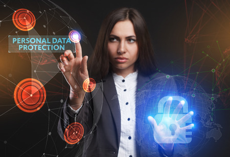 The concept of business, technology, the Internet and the network. A young entrepreneur working on a virtual screen of the future and sees the inscription: Personal data protectionの写真素材