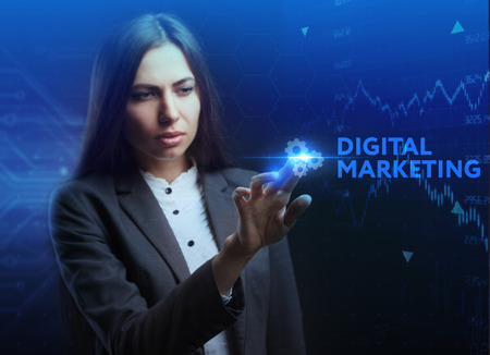 The concept of business, technology, the Internet and the network. A young entrepreneur working on a virtual screen of the future and sees the inscription: Digital Marketingの写真素材